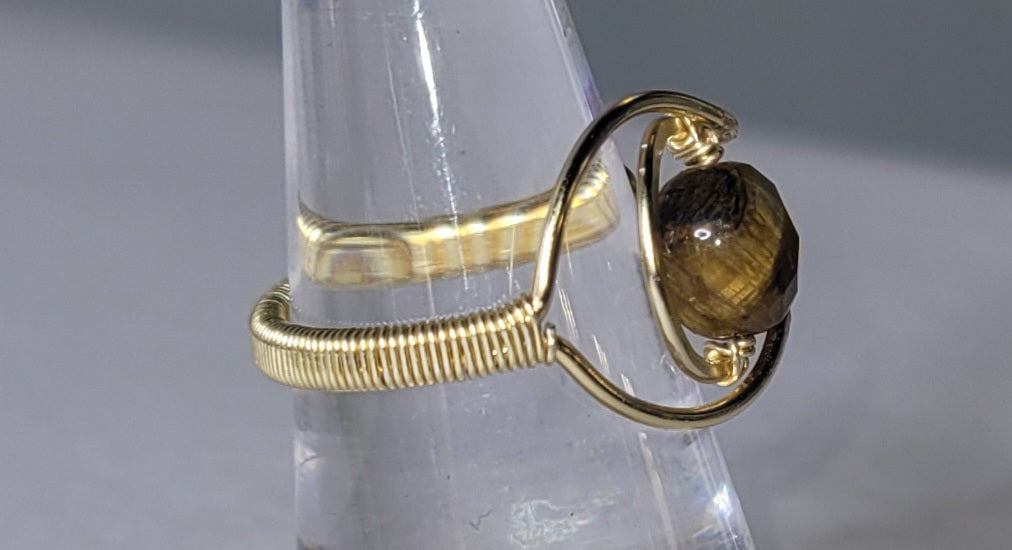 Adjustable Cresent Moon with Tiger Eye
Handwrapped in gold-plated copper