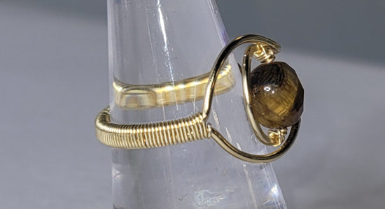 Adjustable Cresent Moon with Tiger Eye
Handwrapped in gold-plated copper