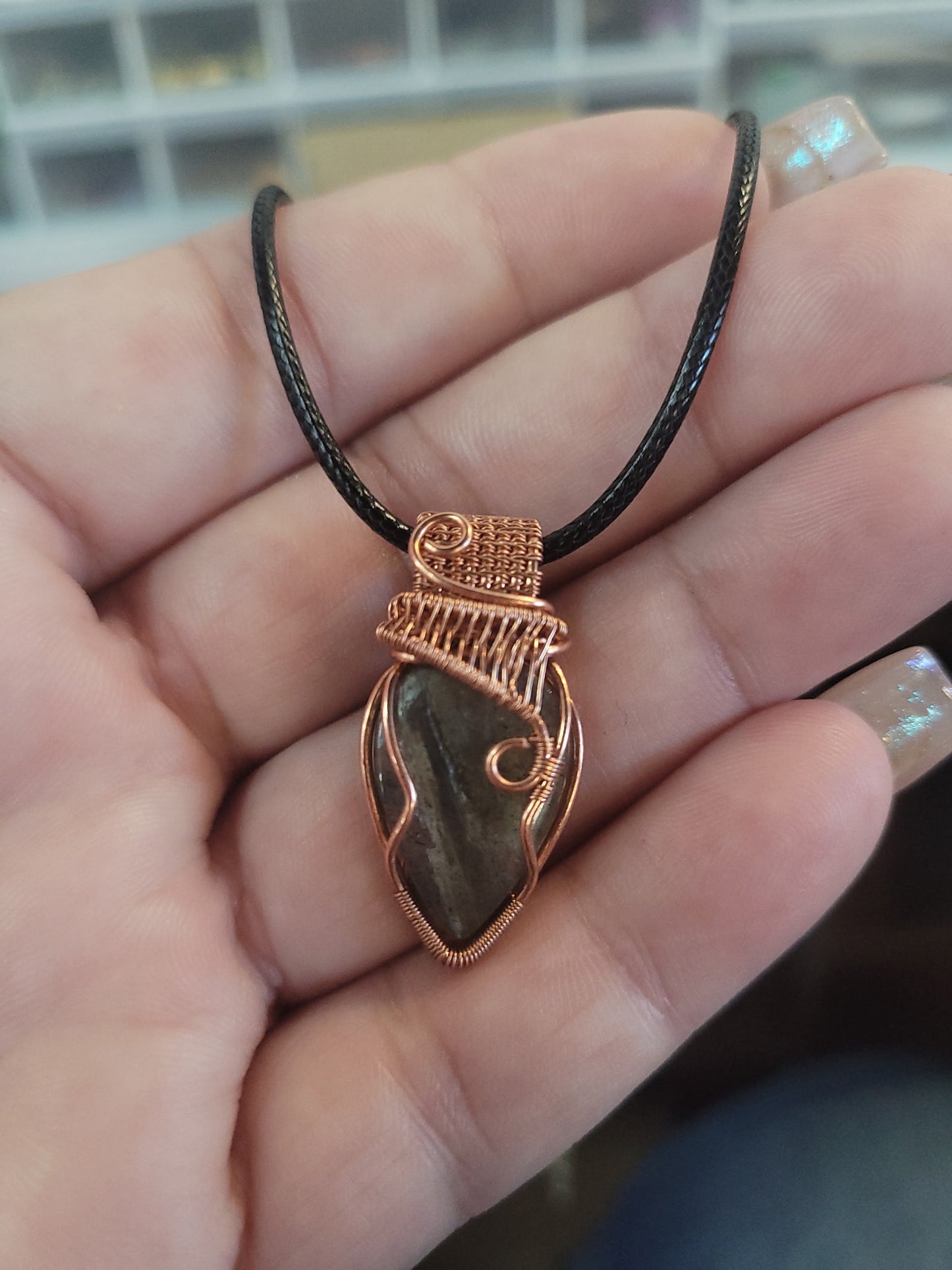 Labadorite pendant 
Hand wrapped in copper