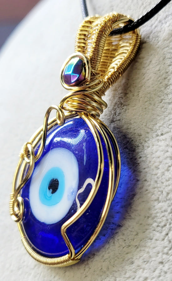 All seeing Eye with Hematite 
Handwrapped in Gold Plated Copper