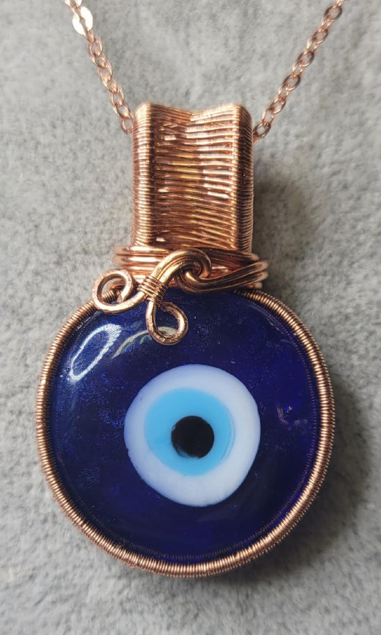 All Seeing Eye Pendent
Hand wrapped in copper wire