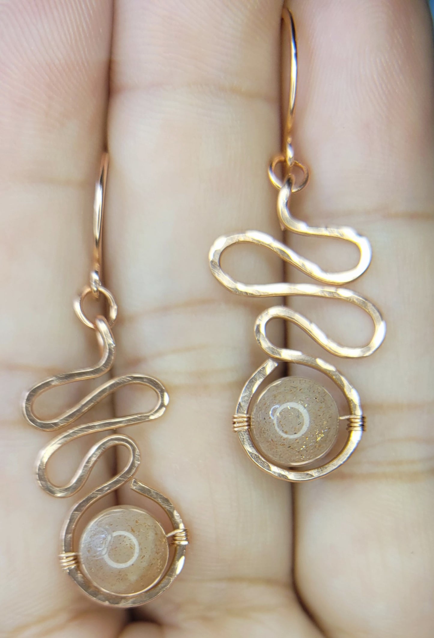Sunstone Earrings 
Hand wrapped in Copper Wire