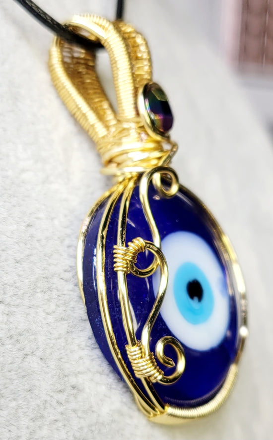 All seeing Eye with Hematite 
Handwrapped in Gold Plated Copper