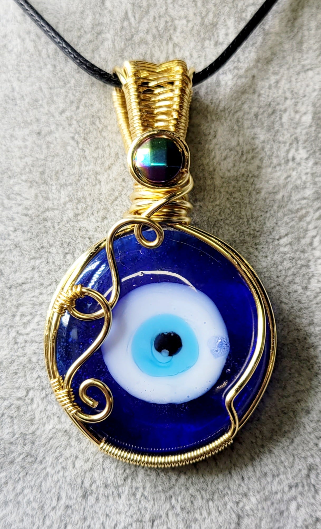 All seeing Eye with Hematite 
Handwrapped in Gold Plated Copper